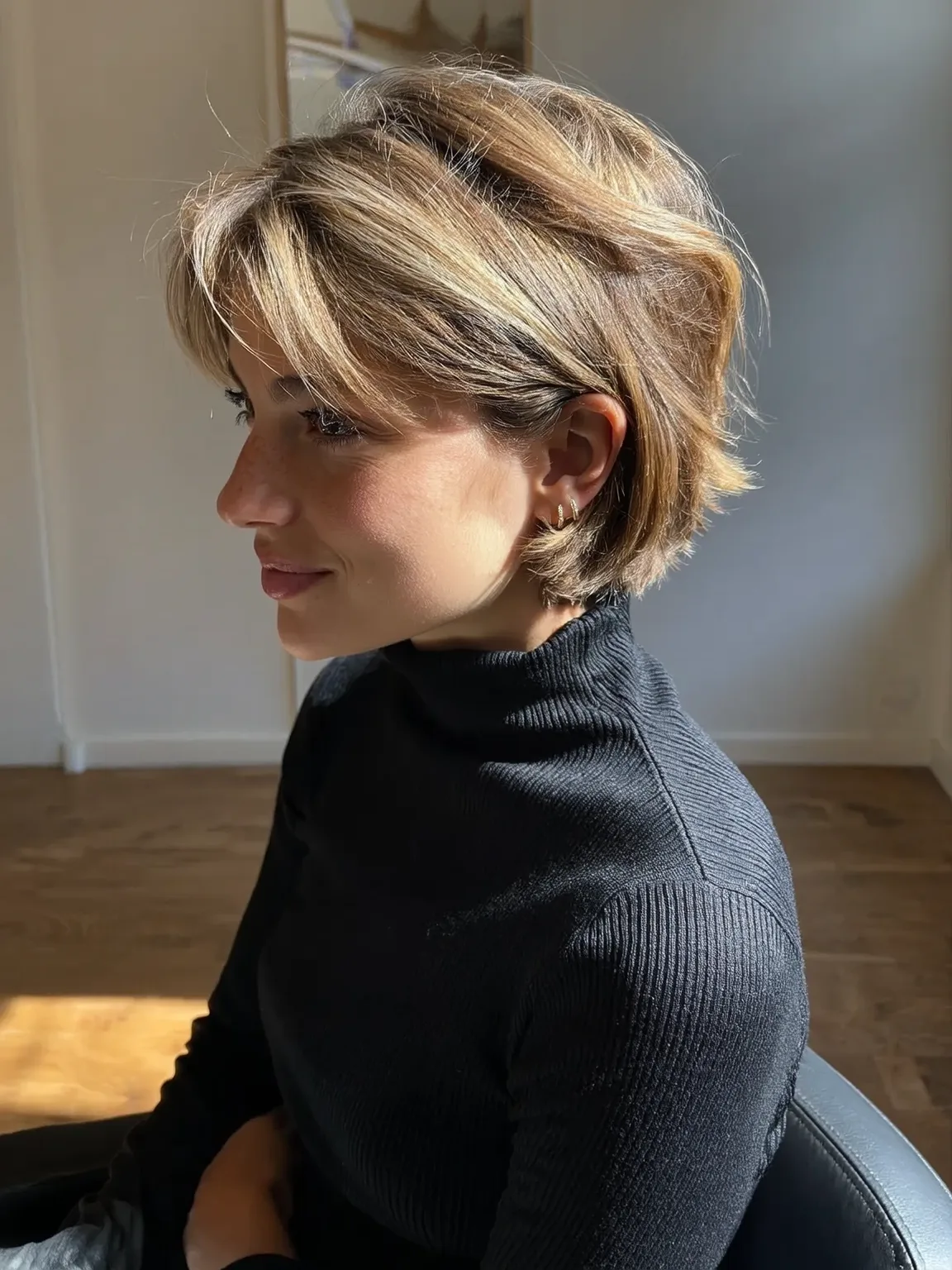 Honey Blonde Layered Bob with Side-Swept Bangs